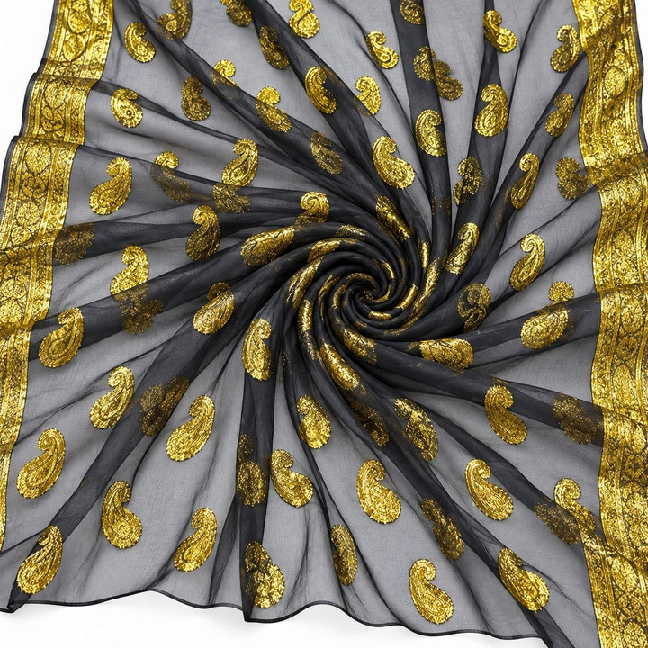 Sort lurex chiffon med gyldent paisleymønster og guldborter – stoffet formet som en spiral (billede 1 af 3)