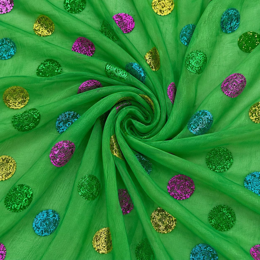 Grøn lurex chiffonsilk med flerfarvede glitrende prikker – stoffet formet som en spiral (billede 1 af 3)