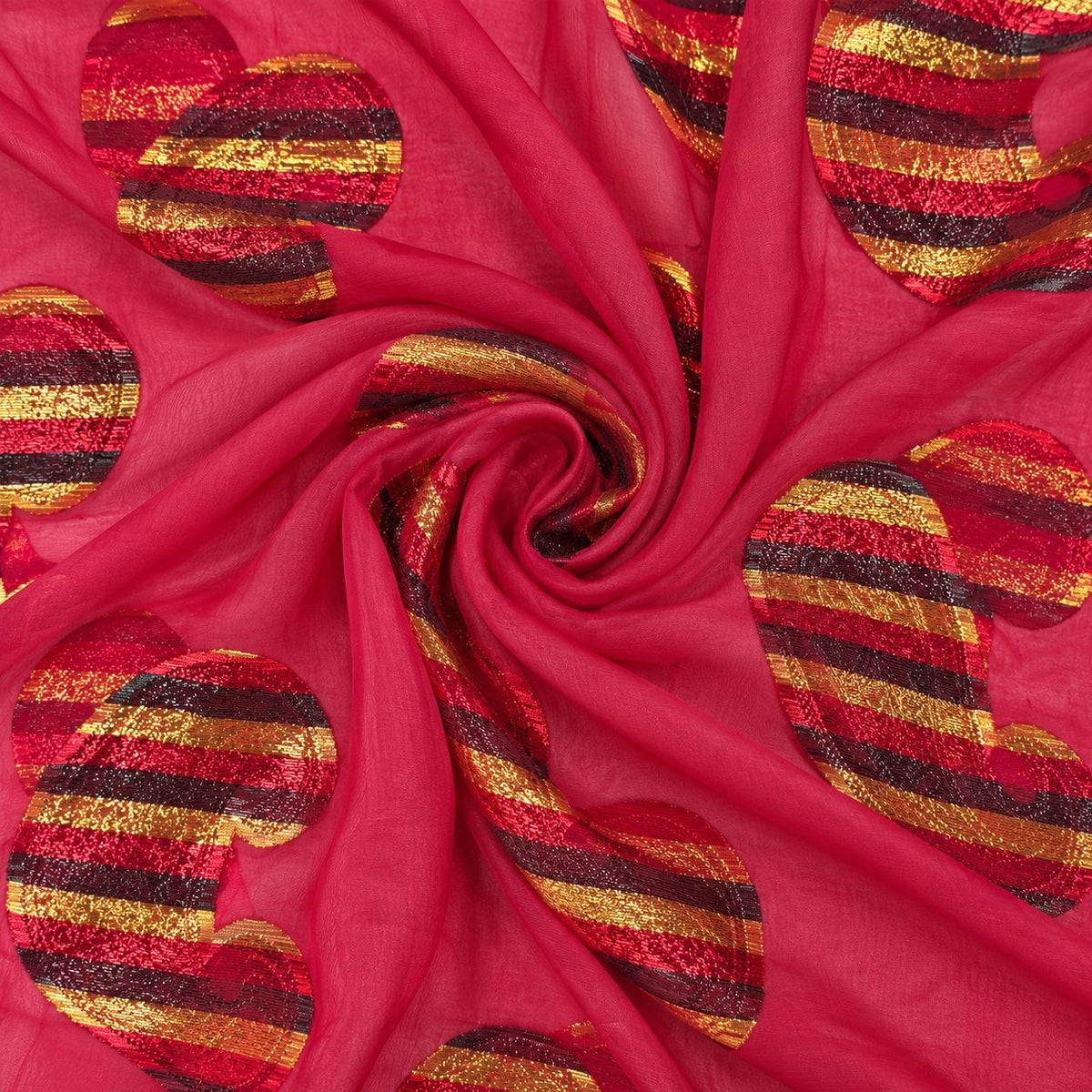 Fuchsia lurex chiffonsilk med flerfarvede stribede paisleymotiver – stoffet formet som en spiral (billede 1 af 3)
