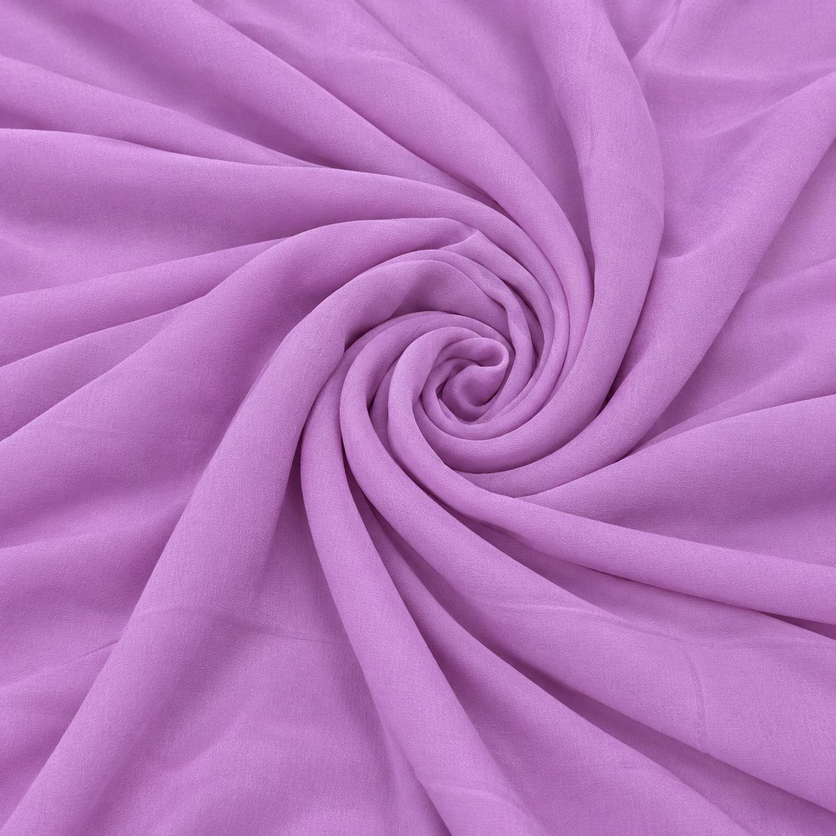Lavendelfarvet silke georgette – 2. sortering – stoffet formet som en spiral, hvor den creppede overflade og de ujævne tråde ses (billede 1 af 3)