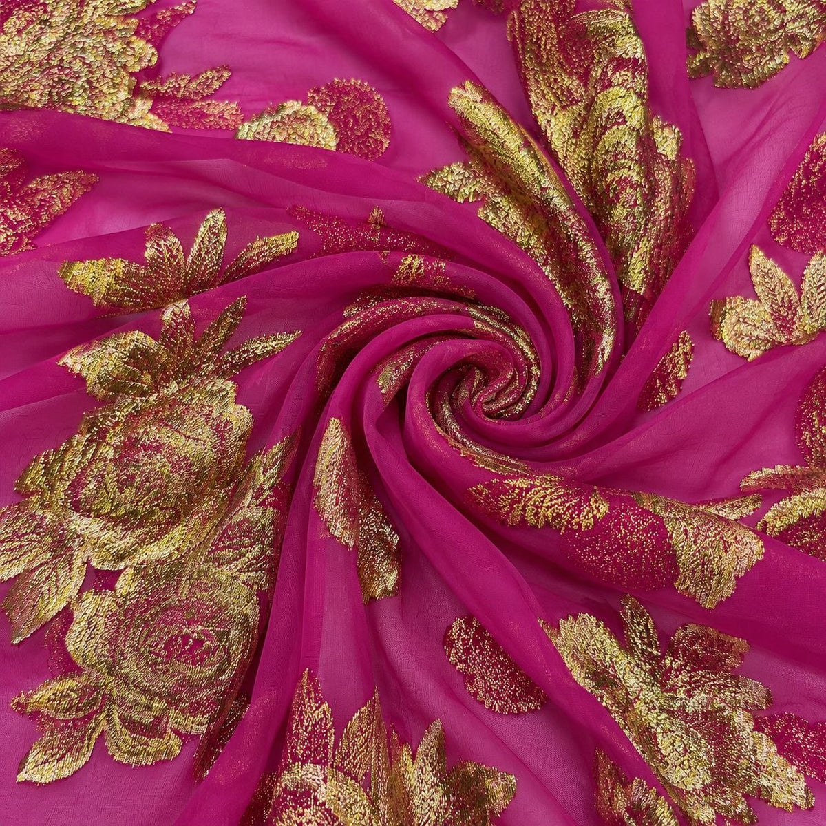 Magenta lurex chiffonsilk med gyldne blomstermotiver – stoffet formet som en spiral (billede 1 af 3)