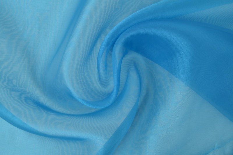 PETROLEUMSBLÅ ORGANZA – TRANSPARENT & SKINNENDE