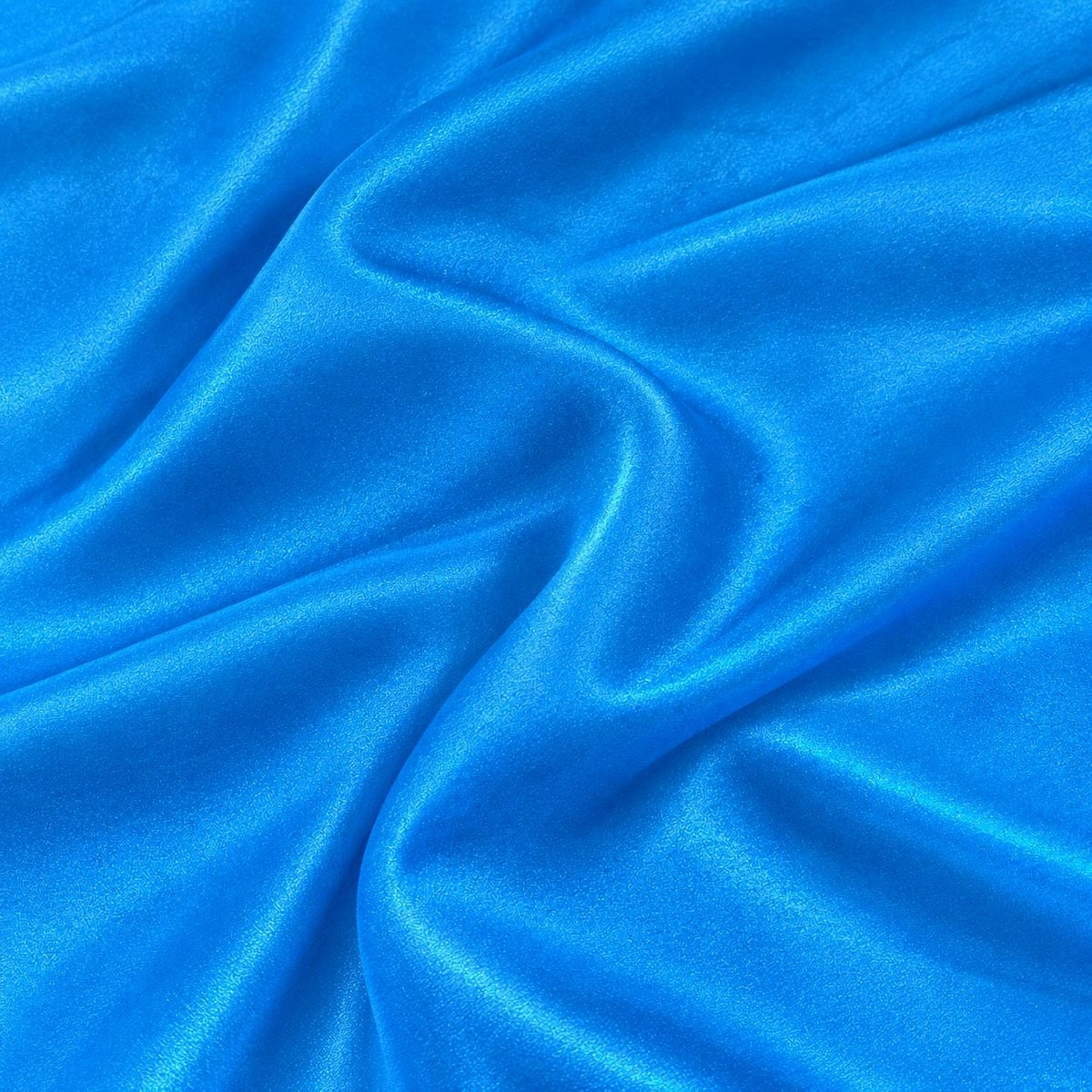 Metallic azure blå foil stof — nærbillede af foliens struktur og glans