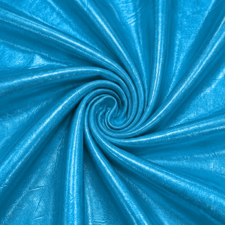 Metallic turkis foil stof — stoffet arrangeret i spiralform med bløde folder