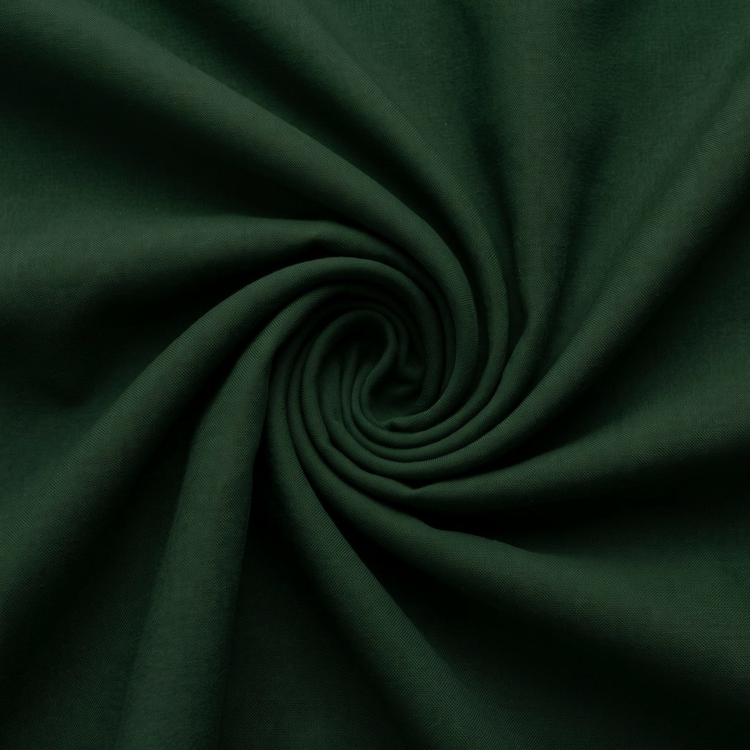 Mørkegrønt micro velour stof – stoffet samlet i en blød swirl (billede 1 af 3)