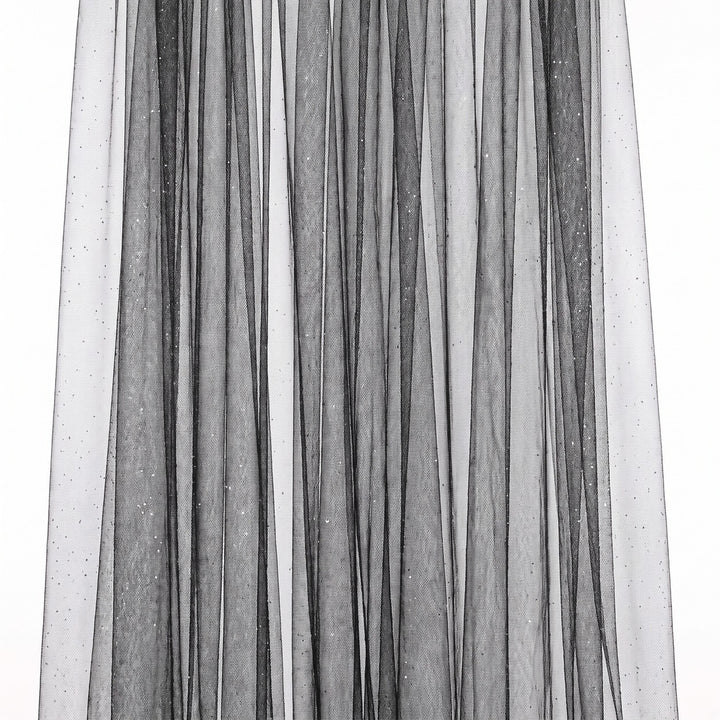 Sort glitter tyl med metallic — stoffet hængende og draperet, glitter fanger lyset