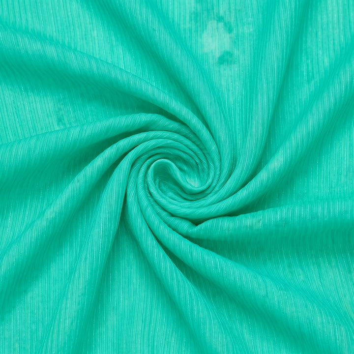 Turkisgrøn/mintgrøn silke chiffon – stoffet samlet i en blød swirl med lysere farveafvigelse i venstre side (billede 1 af 2)