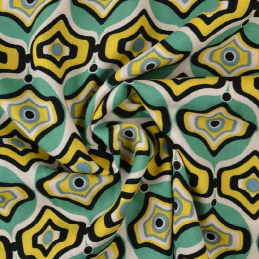 VISKOSE STOF MED TURKIS OG GULT GEOMETRISK BUE PRINT – LET FALD & ELEGANT MAT GLANS