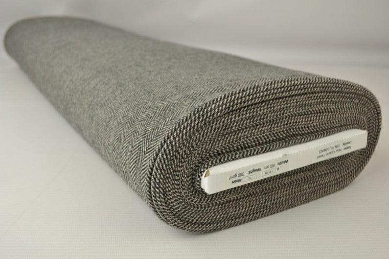 BEIGE ULD/POLYESTER STOF MED TWEEDSTRUKTUR OG SILDEBENSMØNSTER