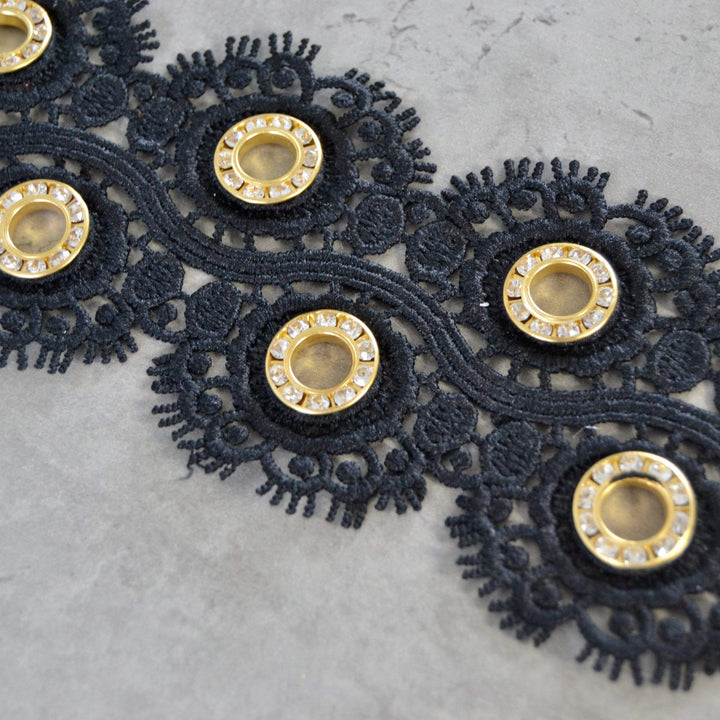 SORT BLOMSTERBÅND MED GULD RINGE 55MM